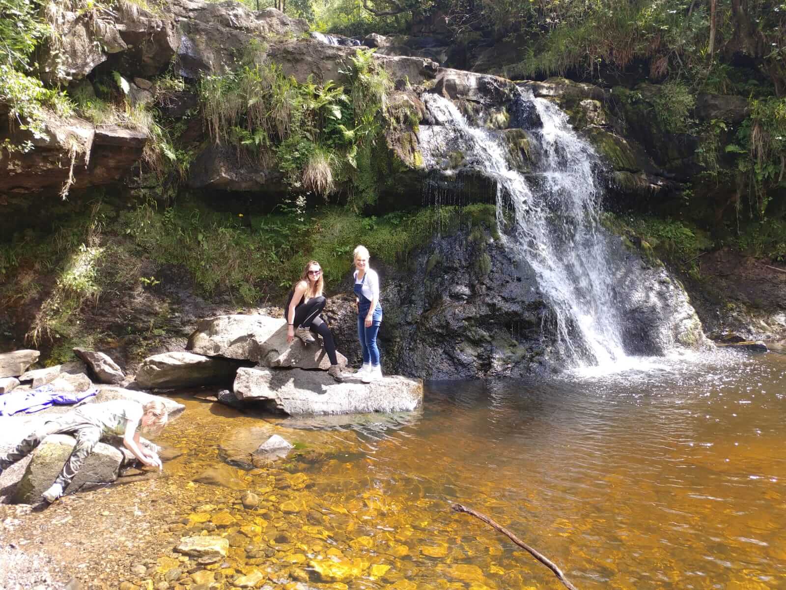 girls by the waterfall